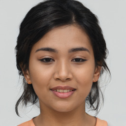 Joyful asian young-adult female with medium  brown hair and brown eyes