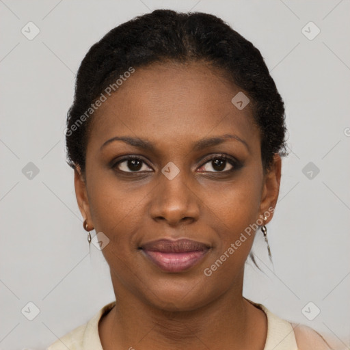 Joyful black young-adult female with short  brown hair and brown eyes