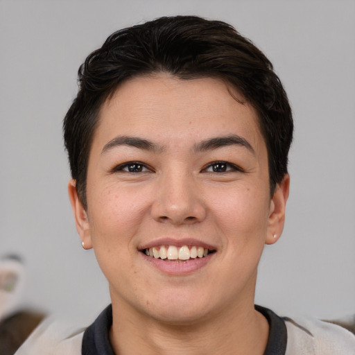 Joyful asian young-adult female with short  brown hair and brown eyes