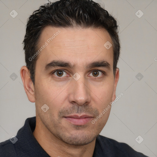 Joyful white adult male with short  brown hair and brown eyes