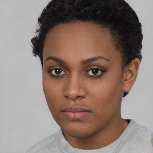Neutral black young-adult female with short  black hair and brown eyes