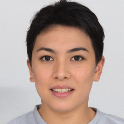 Joyful asian young-adult female with short  black hair and brown eyes