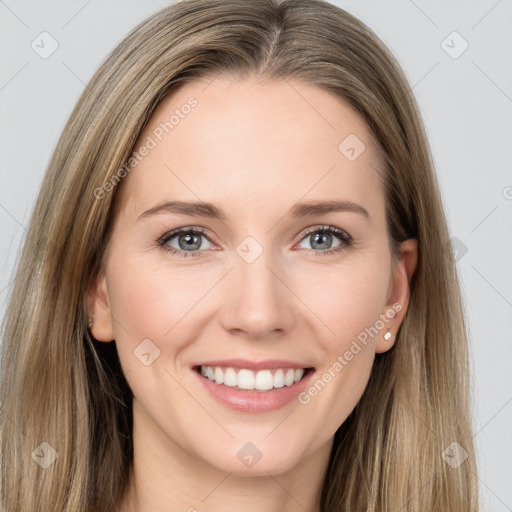 Joyful white young-adult female with long  brown hair and grey eyes