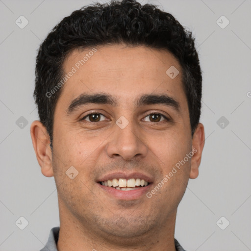 Joyful white young-adult male with short  black hair and brown eyes