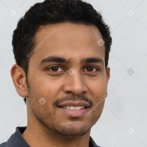 Joyful latino young-adult male with short  brown hair and brown eyes