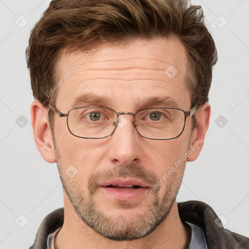 Joyful white adult male with short  brown hair and grey eyes