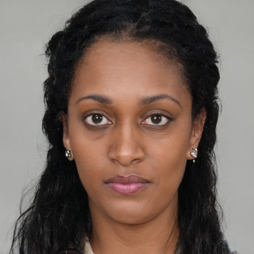 Neutral black young-adult female with long  black hair and brown eyes
