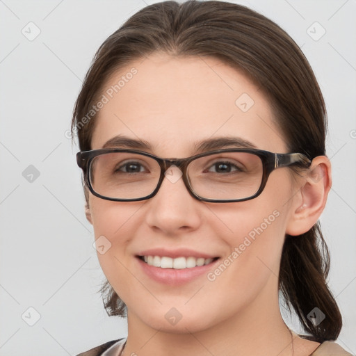 Joyful white young-adult female with medium  brown hair and brown eyes