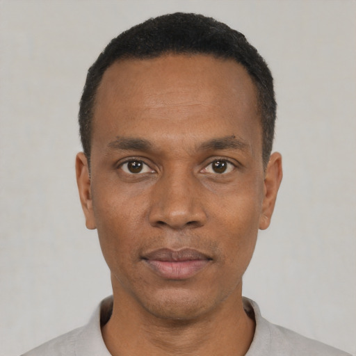Neutral black adult male with short  black hair and brown eyes