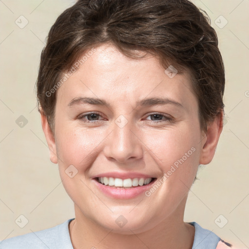 Joyful white young-adult female with short  brown hair and brown eyes