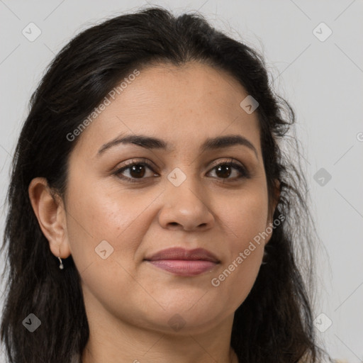 Joyful latino young-adult female with long  brown hair and brown eyes