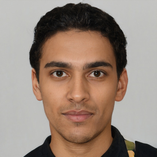 Neutral latino young-adult male with short  black hair and brown eyes