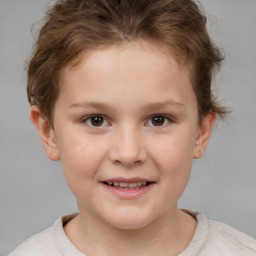 Joyful white child female with short  brown hair and brown eyes