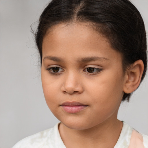 Joyful white child female with medium  brown hair and brown eyes