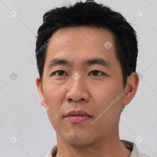 Neutral asian young-adult male with short  brown hair and brown eyes