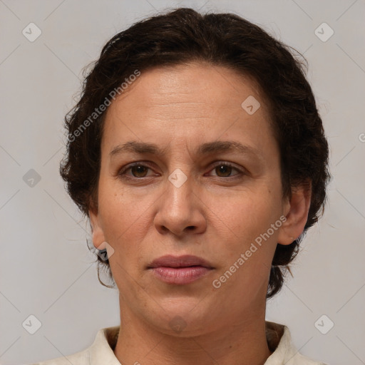 Joyful white adult female with short  brown hair and brown eyes