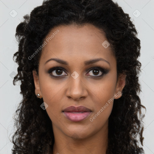 Joyful black young-adult female with long  brown hair and brown eyes