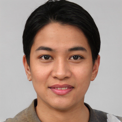Joyful asian young-adult female with short  black hair and brown eyes