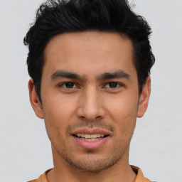 Joyful asian young-adult male with short  brown hair and brown eyes