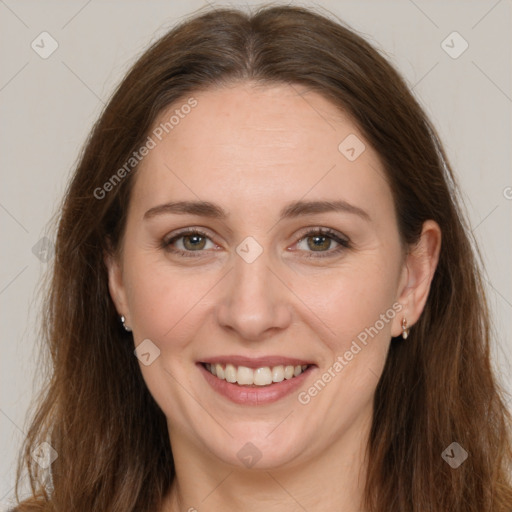 Joyful white adult female with long  brown hair and brown eyes