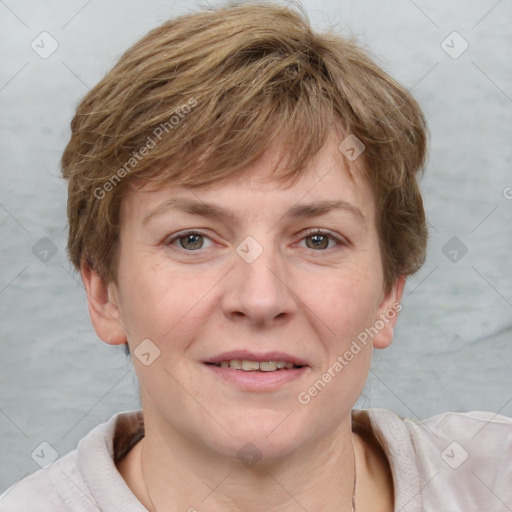 Joyful white adult female with short  brown hair and grey eyes