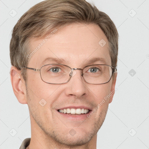 Joyful white adult male with short  brown hair and grey eyes