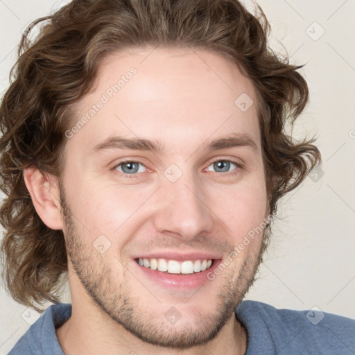 Joyful white young-adult male with medium  brown hair and brown eyes