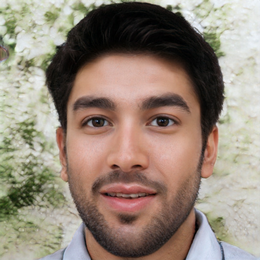 Joyful white young-adult male with short  black hair and brown eyes