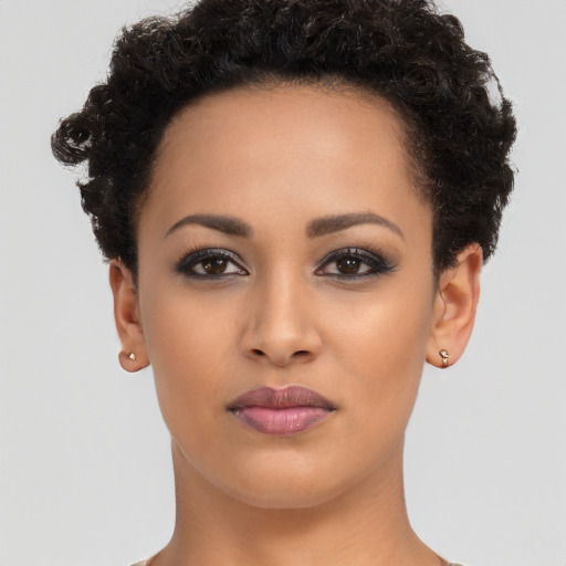 Joyful latino young-adult female with short  brown hair and brown eyes