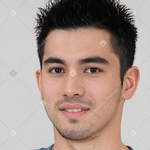 Joyful white young-adult male with short  black hair and brown eyes