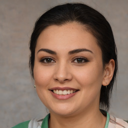 Joyful white young-adult female with medium  brown hair and brown eyes