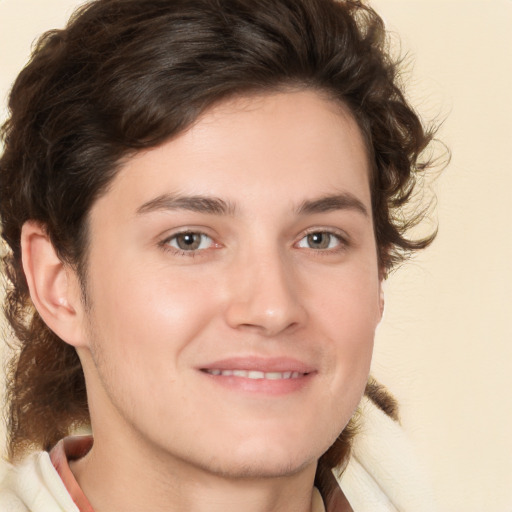 Joyful white young-adult male with medium  brown hair and brown eyes