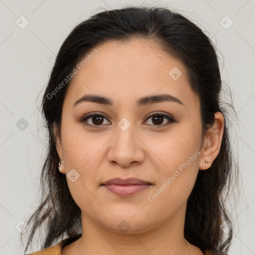 Joyful latino young-adult female with medium  brown hair and brown eyes