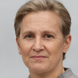 Joyful white middle-aged female with short  brown hair and brown eyes