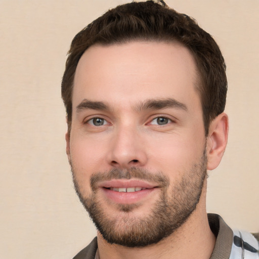 Joyful white young-adult male with short  brown hair and brown eyes