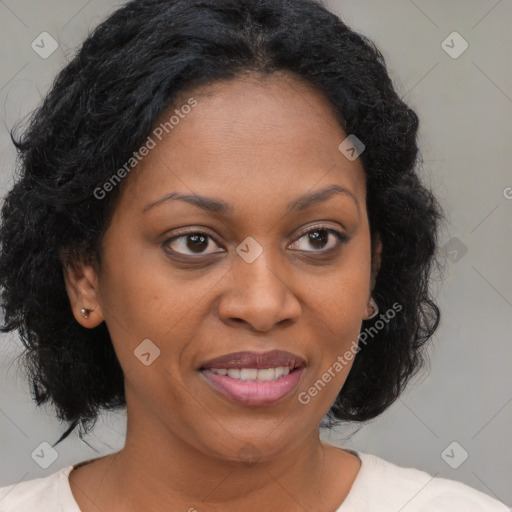 Joyful black adult female with medium  brown hair and brown eyes