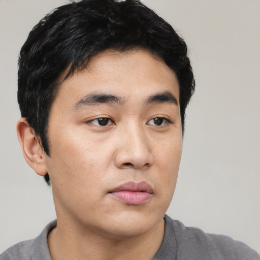 Neutral asian young-adult male with short  black hair and brown eyes