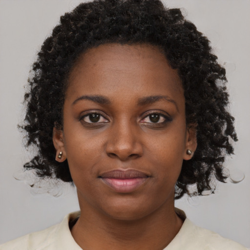 Neutral black young-adult female with short  brown hair and brown eyes
