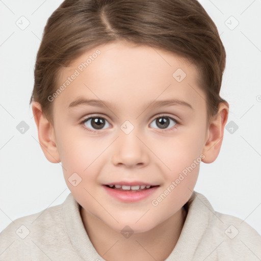 Joyful white child female with short  brown hair and brown eyes