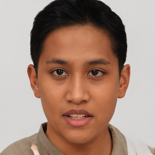 Joyful latino young-adult male with short  brown hair and brown eyes