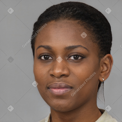 Joyful black young-adult female with short  black hair and brown eyes