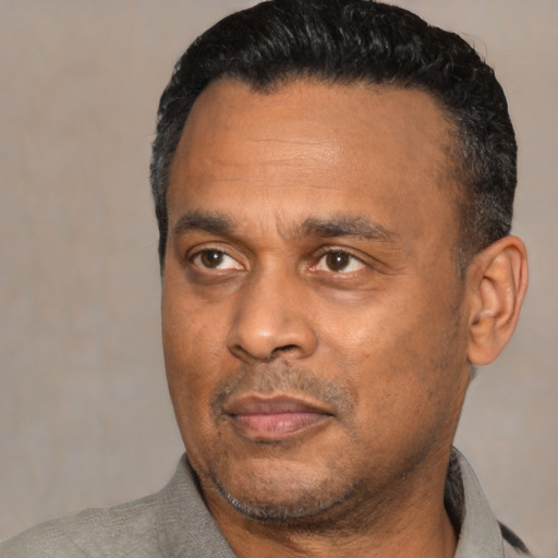 Neutral black adult male with short  black hair and brown eyes