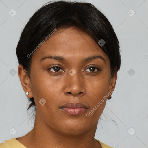 Joyful black young-adult female with short  brown hair and brown eyes