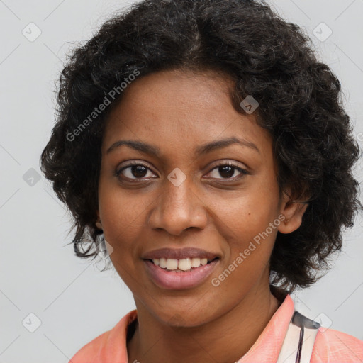 Joyful black young-adult female with long  brown hair and brown eyes