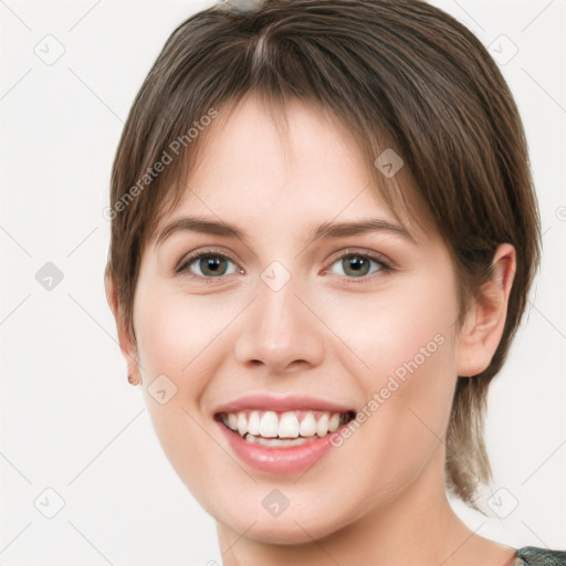 Joyful white young-adult female with medium  brown hair and green eyes