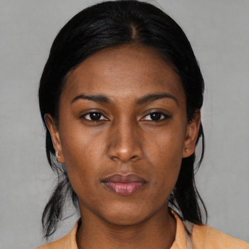 Neutral black young-adult female with medium  black hair and brown eyes