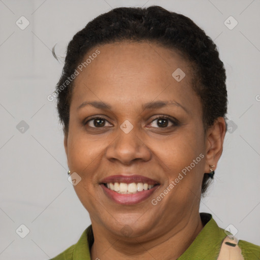 Joyful latino adult female with short  brown hair and brown eyes