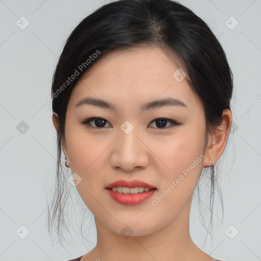 Joyful asian young-adult female with medium  black hair and brown eyes