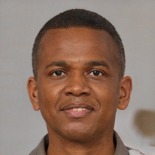 Neutral black young-adult male with short  brown hair and brown eyes