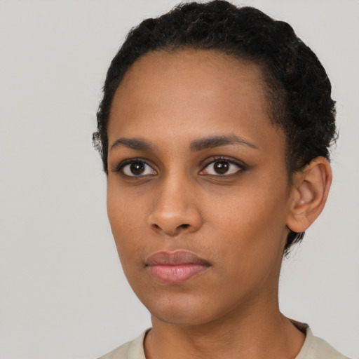 Neutral black young-adult female with short  black hair and brown eyes